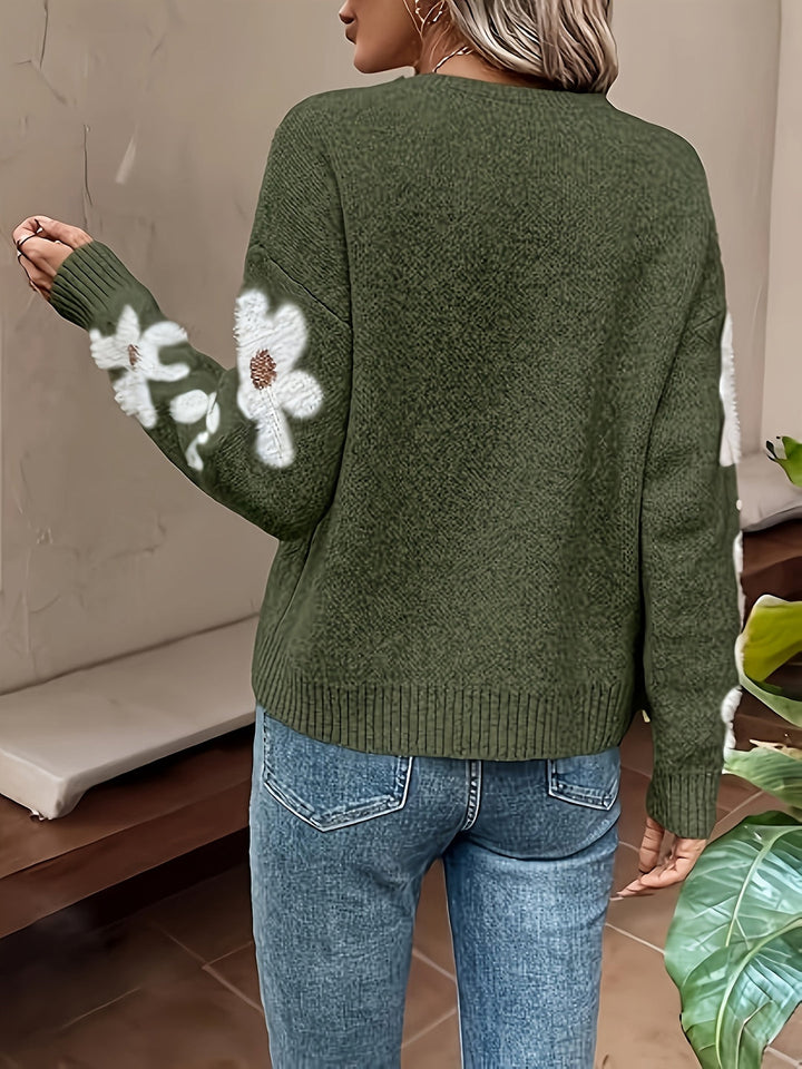 Stylish women's winter sweater with a charming daisy motif, perfect as a casual top.