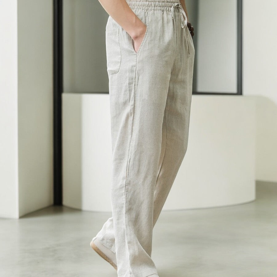 Close-up of breathable linen fabric on women's relaxed fit pants, ideal for warm weather
