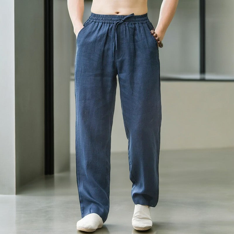 Woman sitting cross-legged wearing relaxed fit linen pants, emphasizing comfort and flexibility