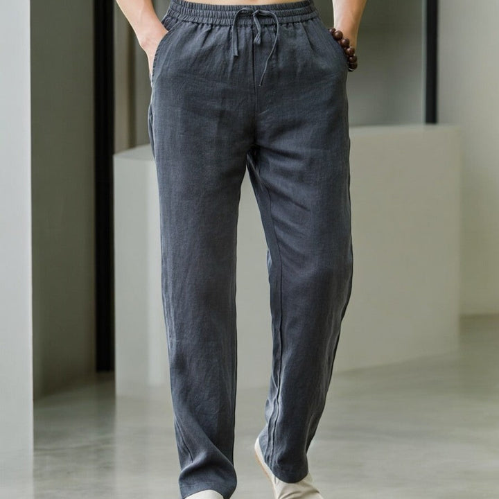 Back view of women's relaxed fit linen pants, showing a simple, elegant cut and breathable material