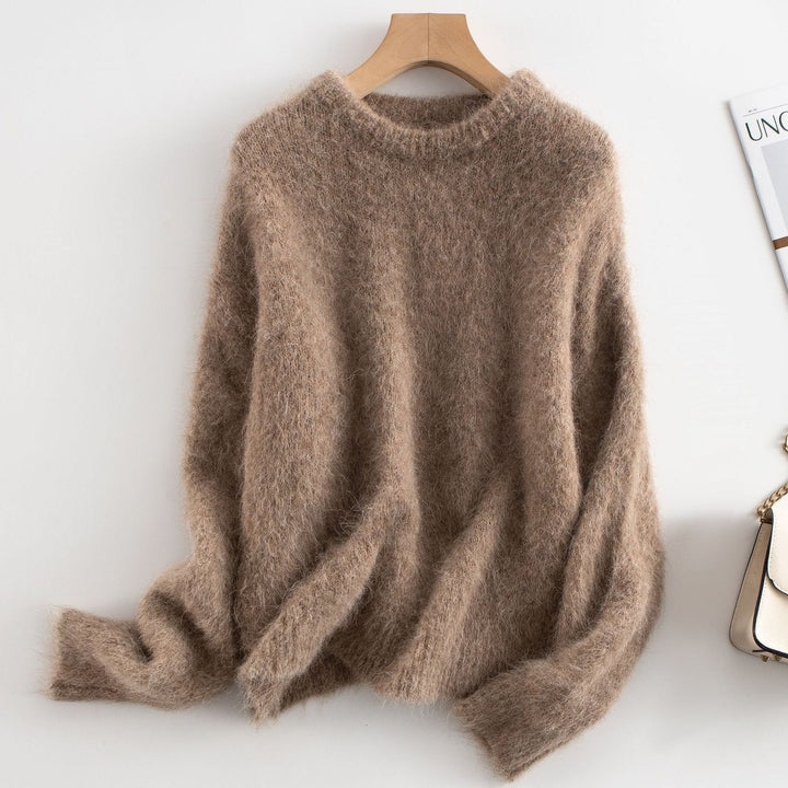 Closeup of the ribbed knit texture on a women's relaxed fit crew neck sweater.