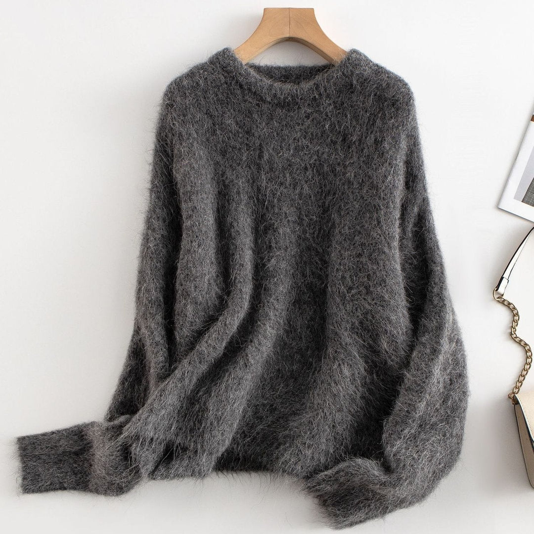 Model wearing a women's relaxed fit ribbed sweater, showcasing its comfortable fit.