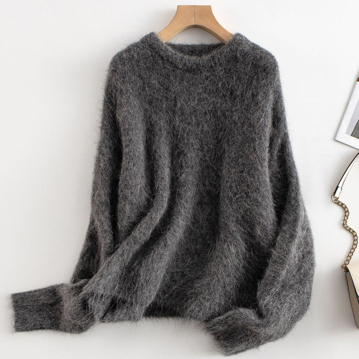 Model wearing a women's relaxed fit ribbed sweater, showcasing its comfortable fit.