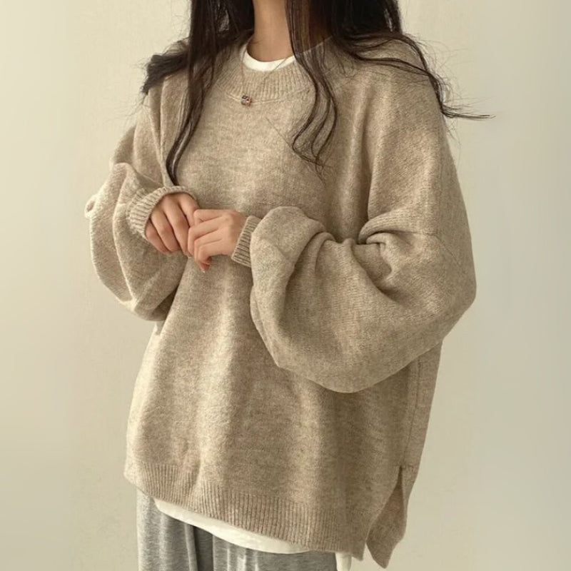 Casual women's knit sweater with relaxed hem and drop shoulder, perfect for fall fashion