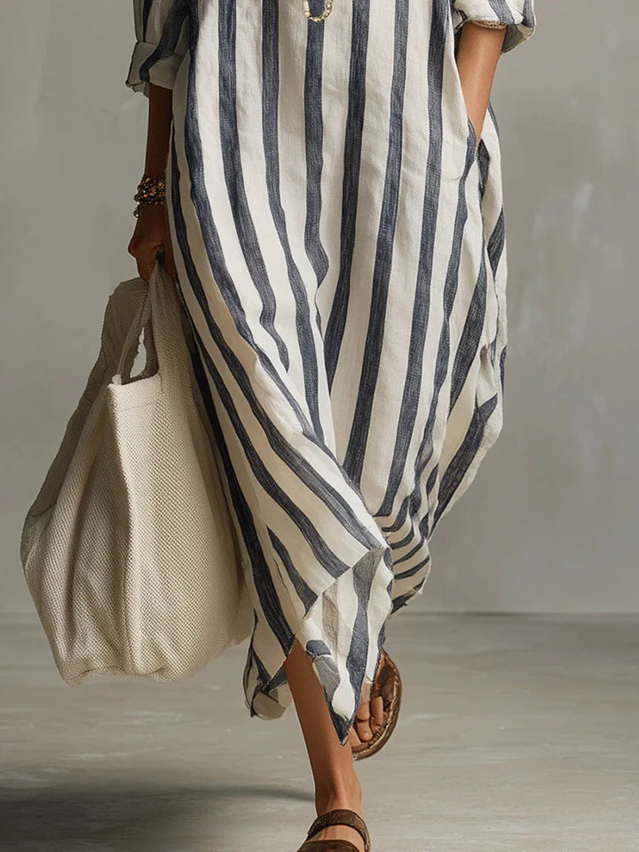 Flowy women's long shirt dress with a relaxed fit. V-neck, three-quarter sleeves for comfortable summer style and fashion.