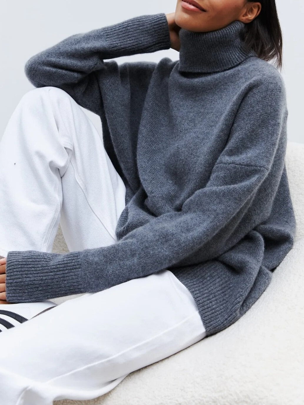 Chic women's turtleneck sweater in a soft merino blend knit, offering both style and warmth for winter.