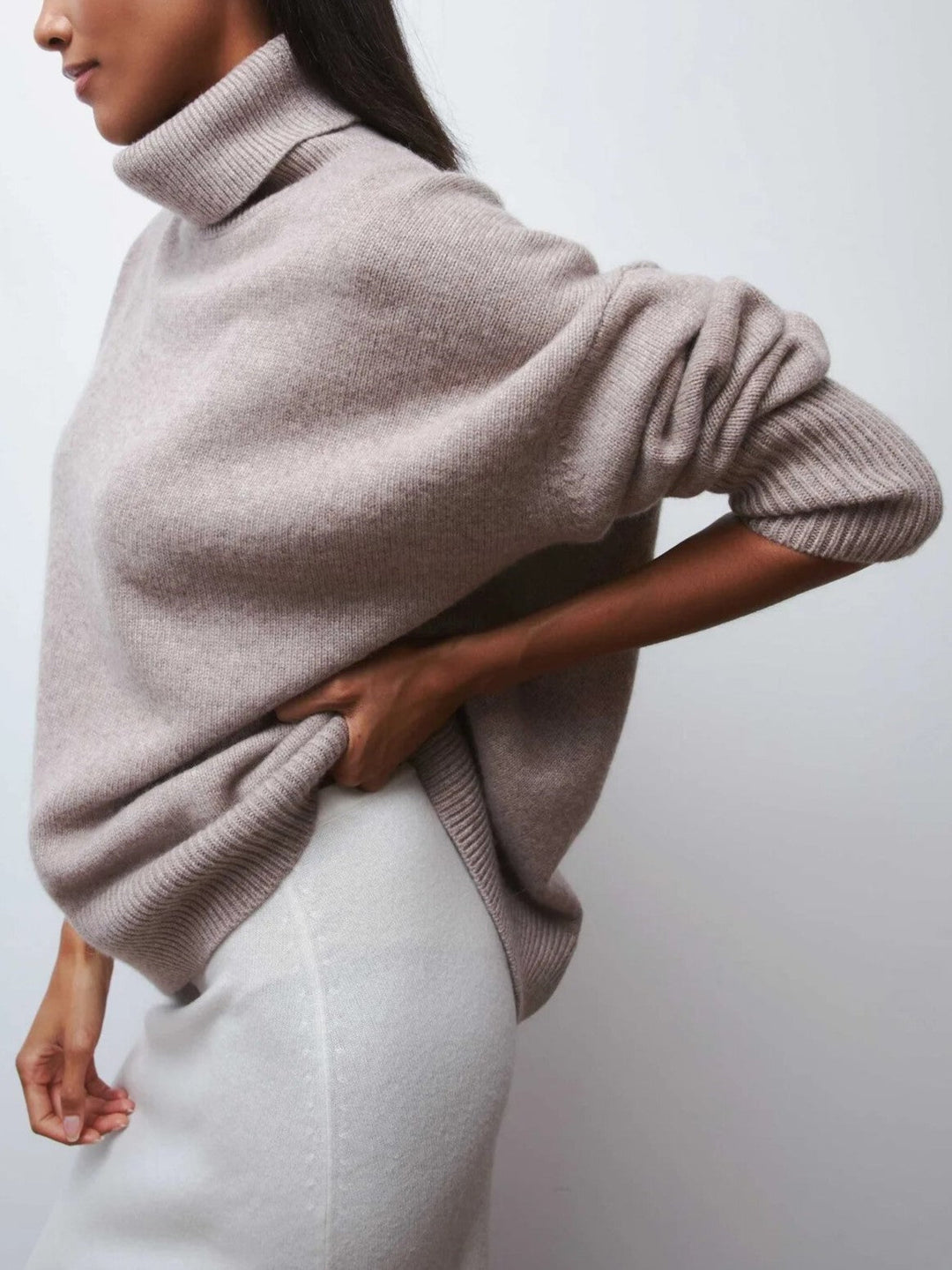Long sleeve women's merino blend turtleneck, a comfortable and elegant oversized sweater for casual outings.