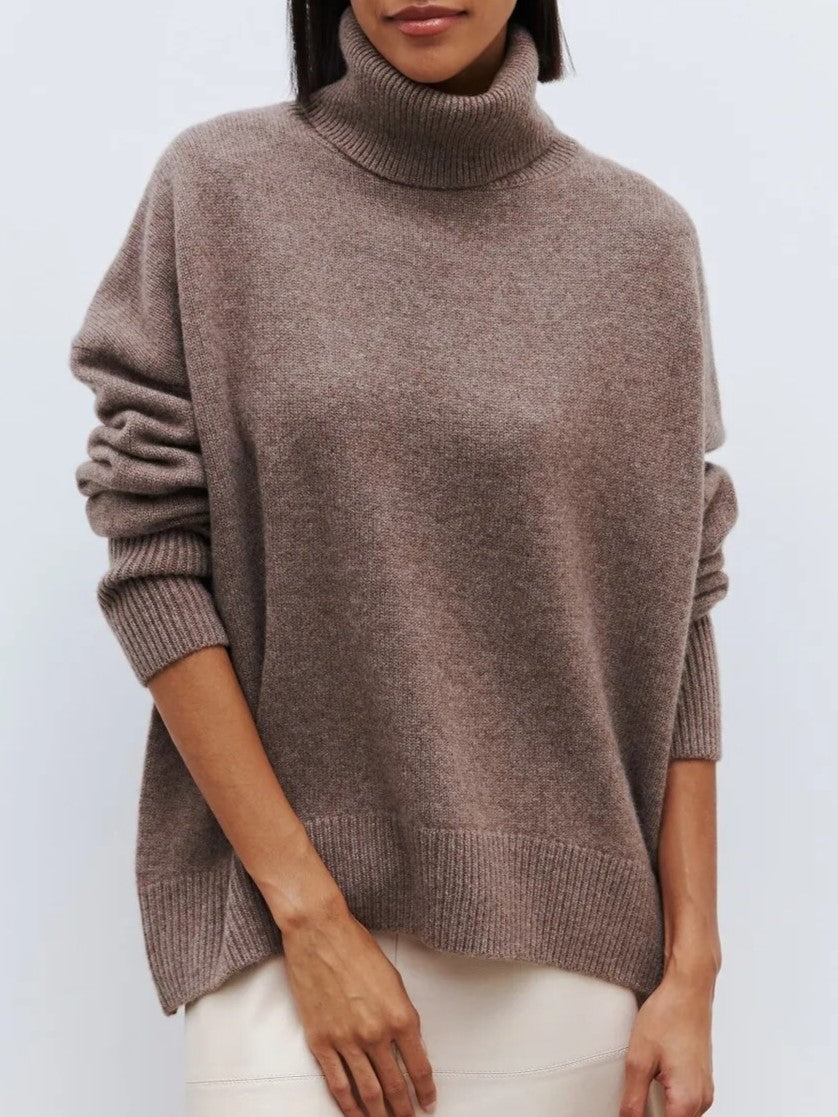 Stylish women's relaxed merino blend turtleneck sweater, perfect for layering during cooler winter days.