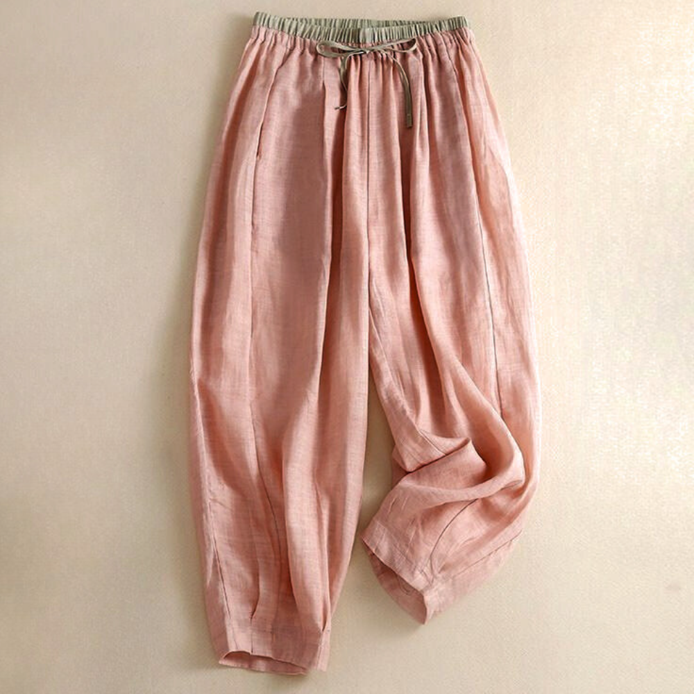 Women's relaxed tapered linen trousers in a light neutral color, perfect for summer casual wear.