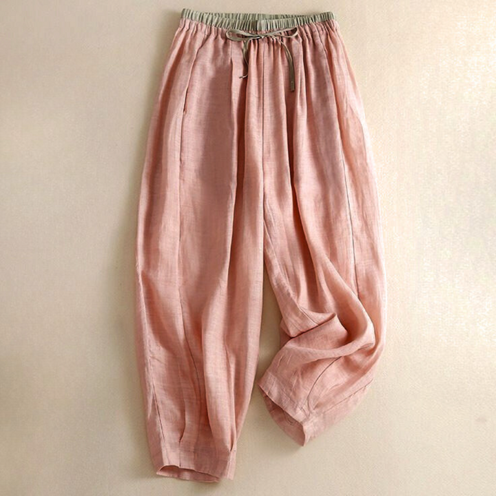 Women's relaxed tapered linen trousers in a light neutral color, perfect for summer casual wear.