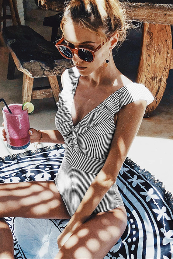 Women's retro striped one-piece swimsuit in blue, red & black, perfect for vintage beach fashion.
