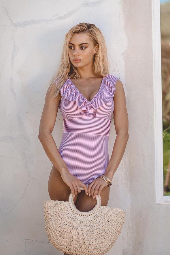 Vintage style one-piece swimwear with bold stripes, a flattering choice for women's summer outfit.