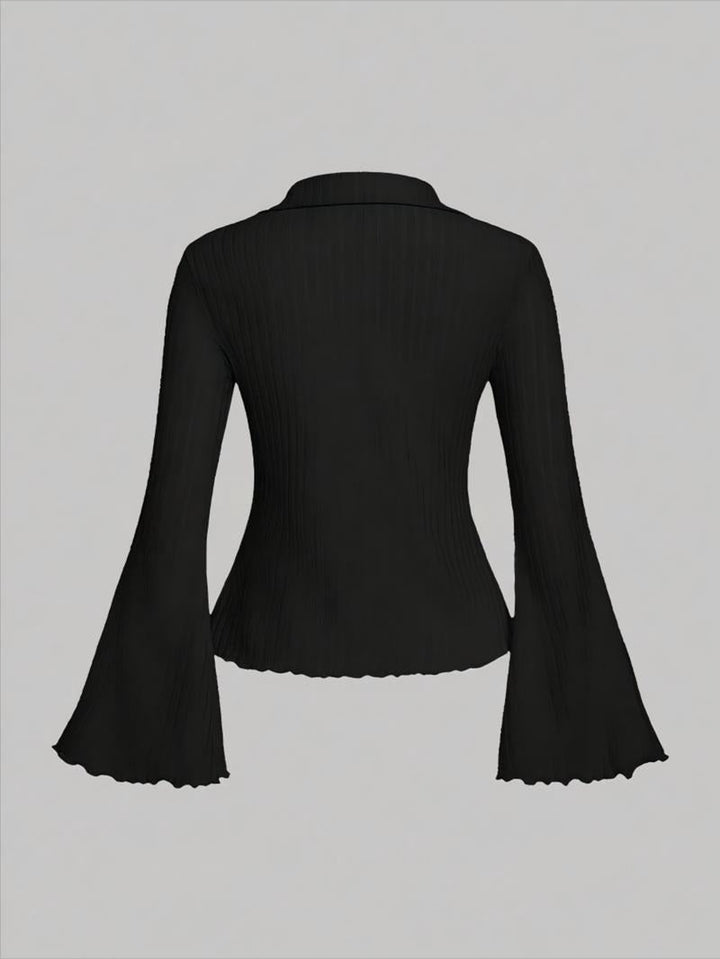 Product shot of a women's ribbed knit blouse. Cream color, prominent flared sleeves and scalloped hem detail. Casual.