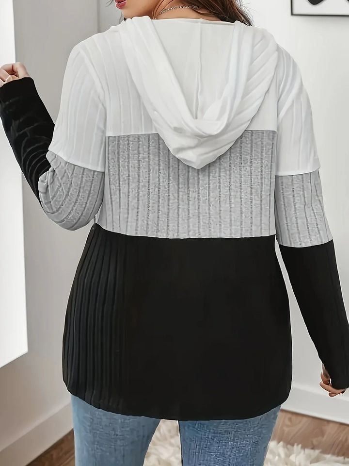 Stylish woman wearing a casual ribbed knit color block hoodie, perfect for everyday