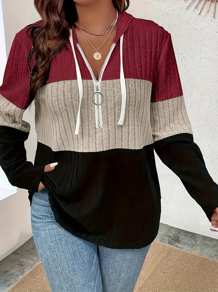 Detail of the ribbed knit pattern on a women's color block hoodie sleeve