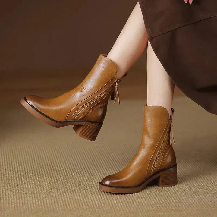 Women's Salerno platform ankle boots in black leather with block heel, side zipper, and elegant design.