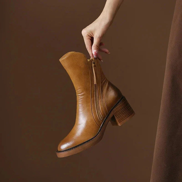 Close-up of the elegant block heel and platform sole of Salerno women's leather ankle boots.