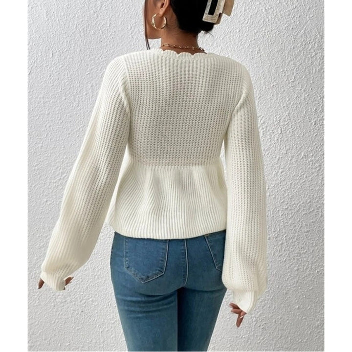 Feminine scallop neck tie-front knit top for women. Versatile, casual long sleeve blouse.