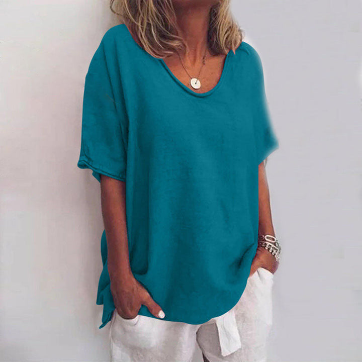 Effortless women's short sleeve blouse with a scoop neck and loose fit, ideal for comfortable casual style.