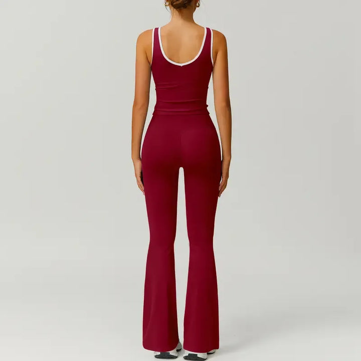 Full body shot of a woman wearing the black capri legging and sports bra set in an active pose