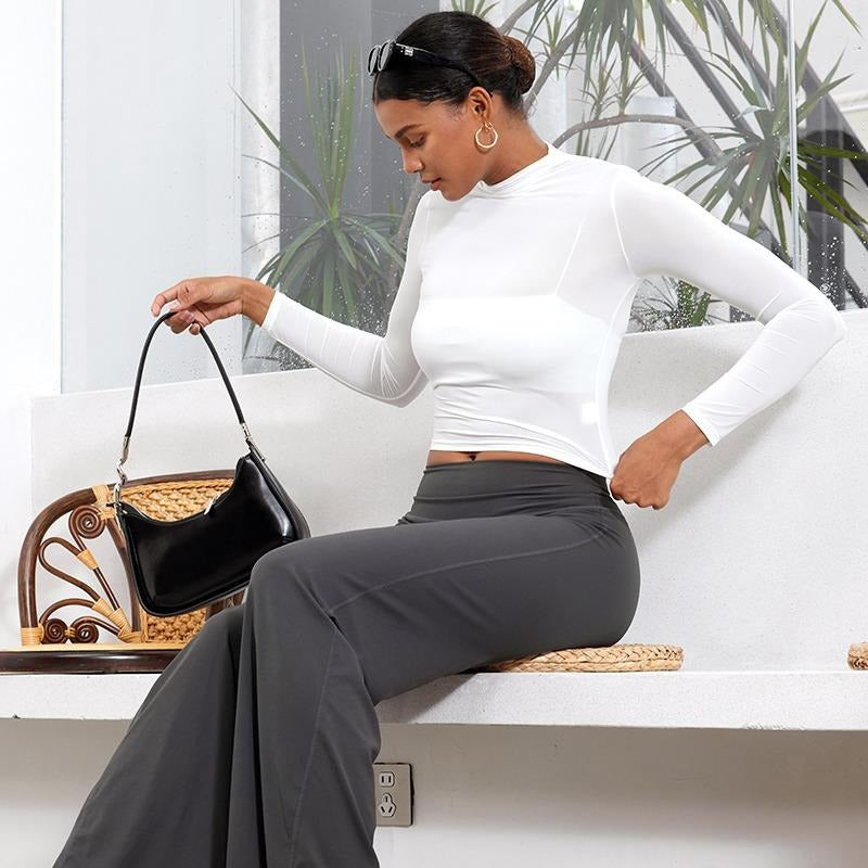 Lifestyle shot: woman stretching in seamless high-waist sculpt leggings, comfortable activewear