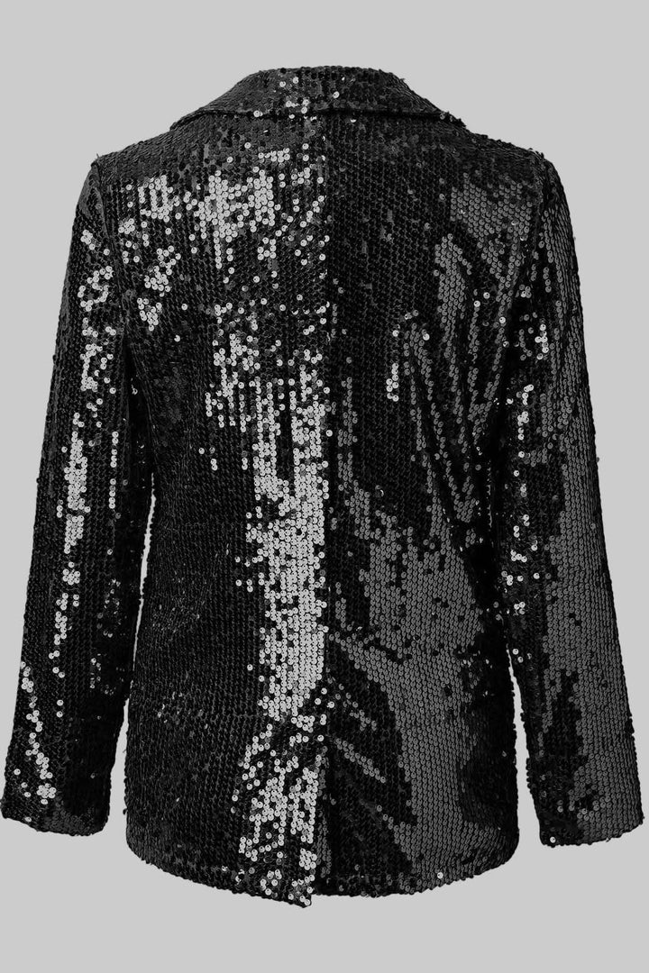 Glamorous hip-length sequin blazer for women, an elegant statement piece for evening events.
