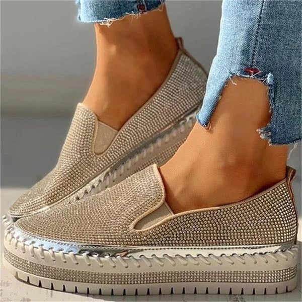 Chic women's elegant slip-on shoes with shimmery embellishments. Comfortable flats ideal for spring, summer, and parties.