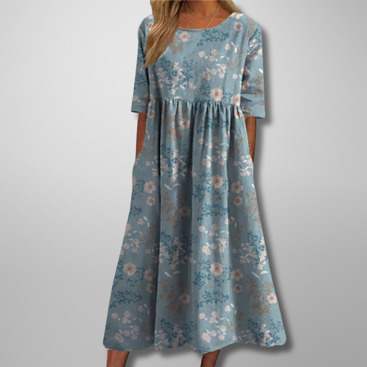 Women's printed short sleeve midi dress with a flowy loose fit, round neck, and stylish botanical pattern.