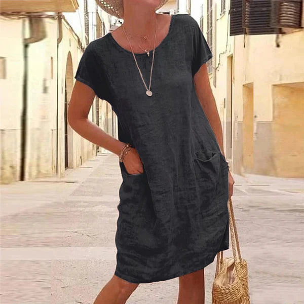 Women's short sleeve midi dress with pockets, perfect for casual summer wear and effortless everyday style.