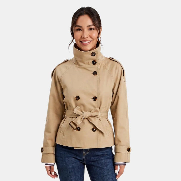 Stylish women's short trench coat, versatile and lightweight. Features an adjustable belt for a flattering fit. Ideal for spring.