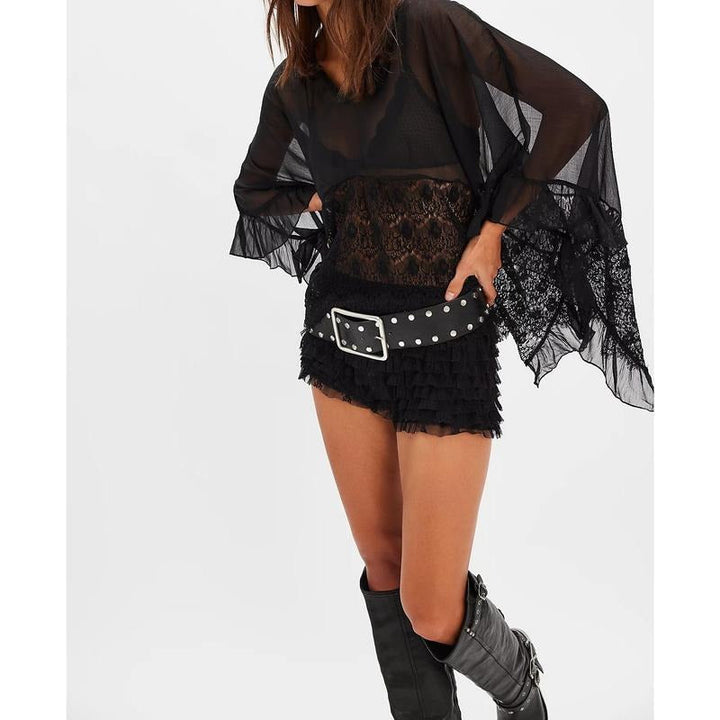 Close-up of Siena women's sheer lace poncho top texture, perfect for layering apparel.