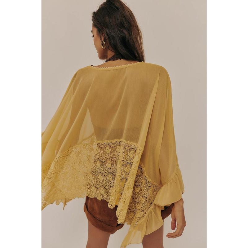 Full shot of Women's Siena sheer lace poncho top, a must-have for summer fashion and layering.
