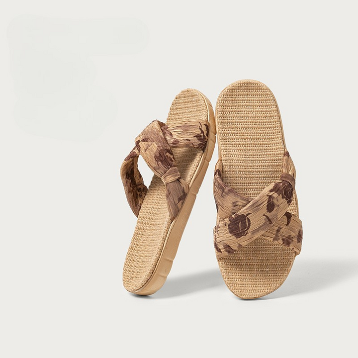 Close-up of Sierra woven sandals for women, showcasing detailed straps and comfortable flat sole design