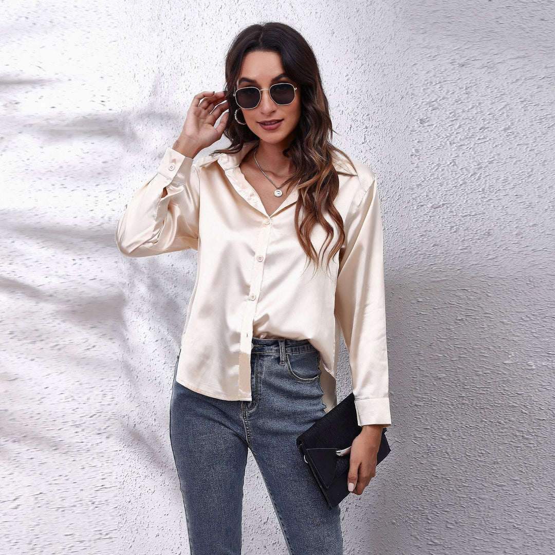 Silky women's blouse, button-down front and loose fit make it a chic and comfortable choice.
