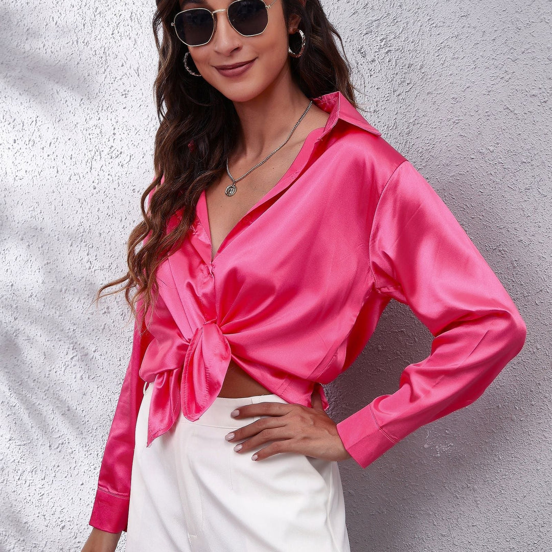 Elegant long sleeve satin blouse for women, a versatile button-down top for casual or formal wear.