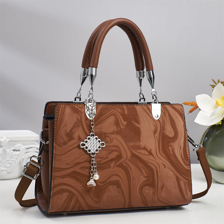 Sleek and minimalist women's square crossbody bag, an essential fashion accessory with a chain strap