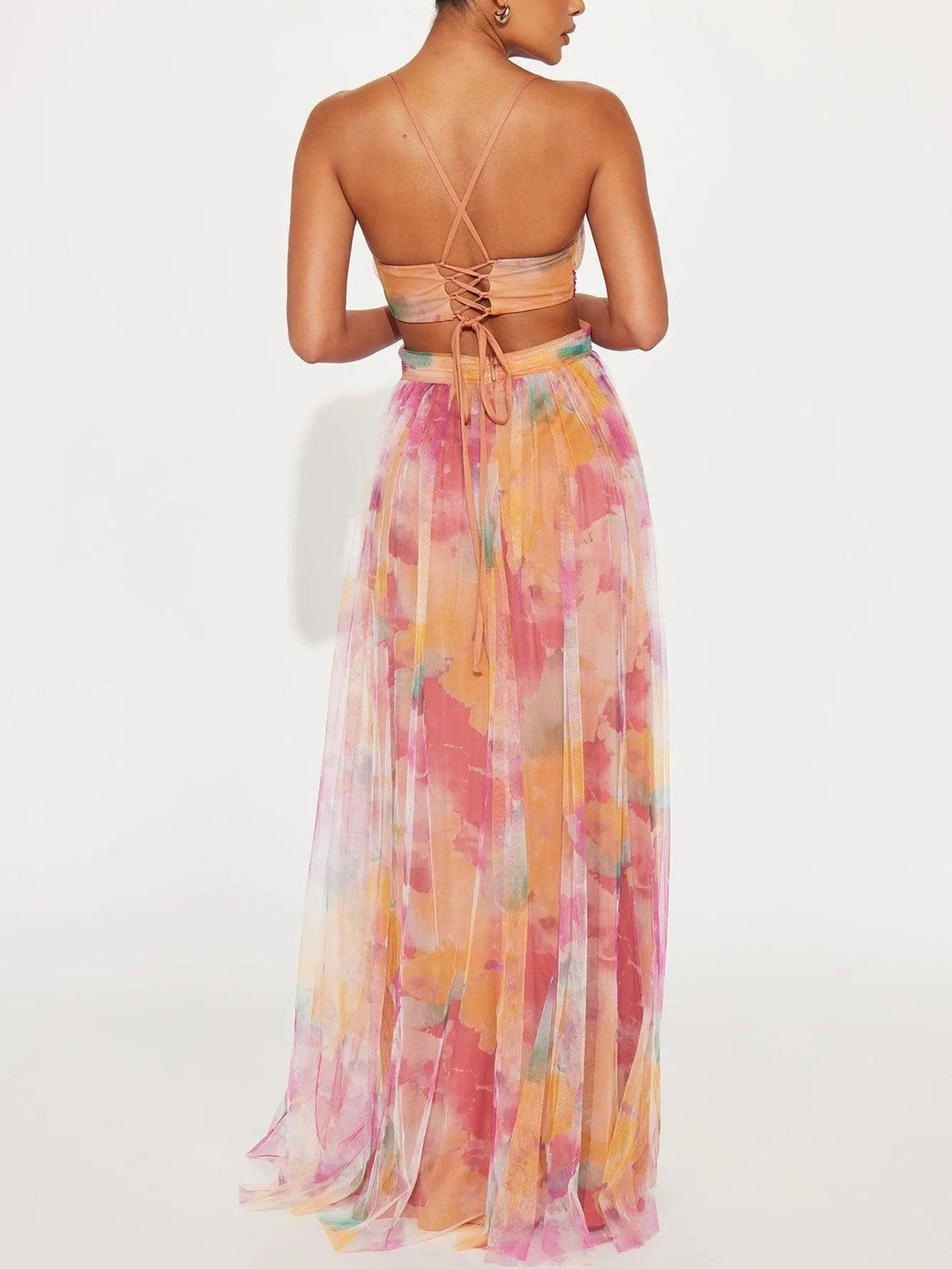 Vibrant floral print sleeveless maxi dress for women. Features a chic v-neck and adjustable tie waist.