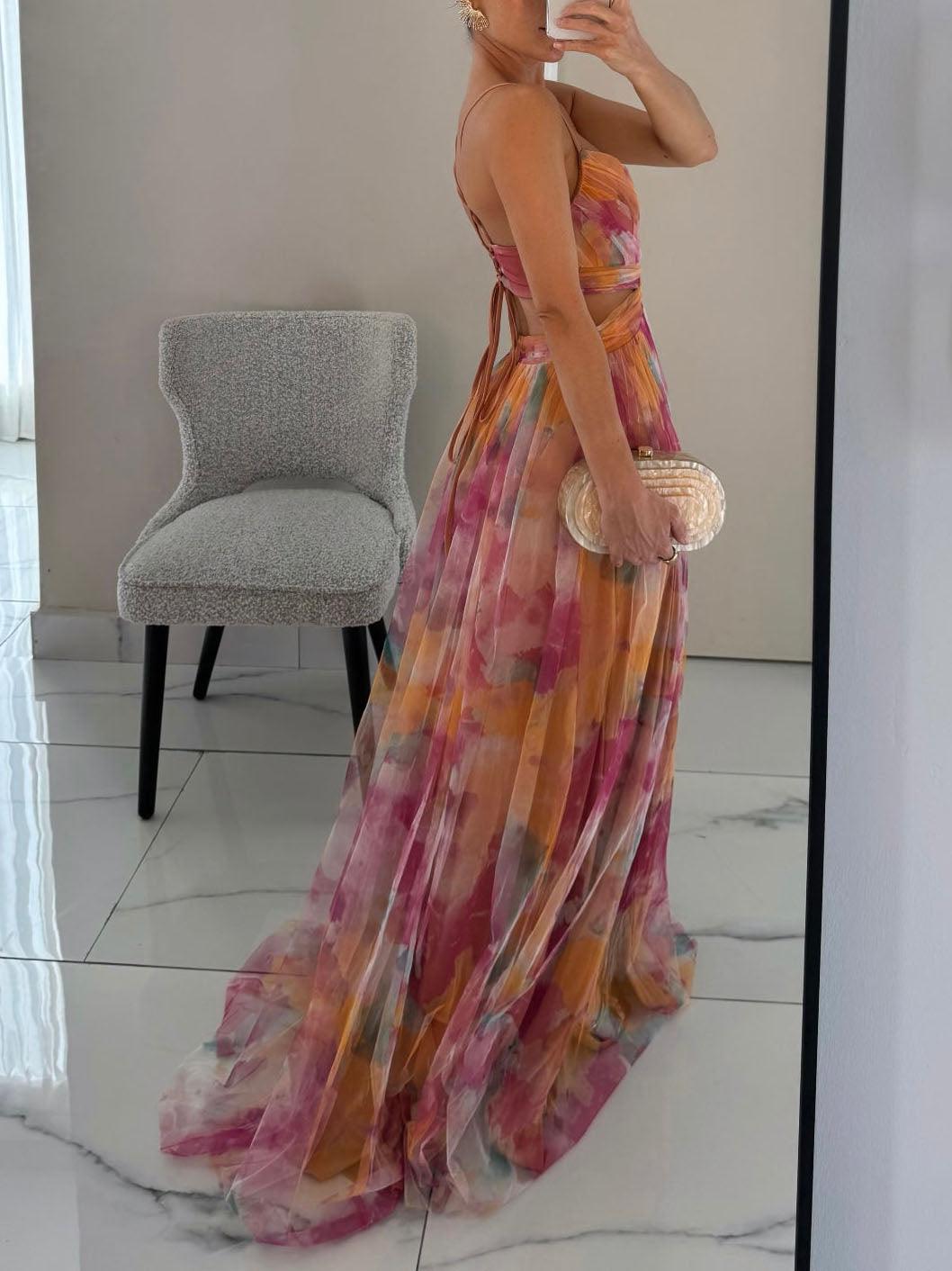 Women's elegant floral maxi dress, sleeveless v-neck with a cinched tie waist. Ideal for warm weather.