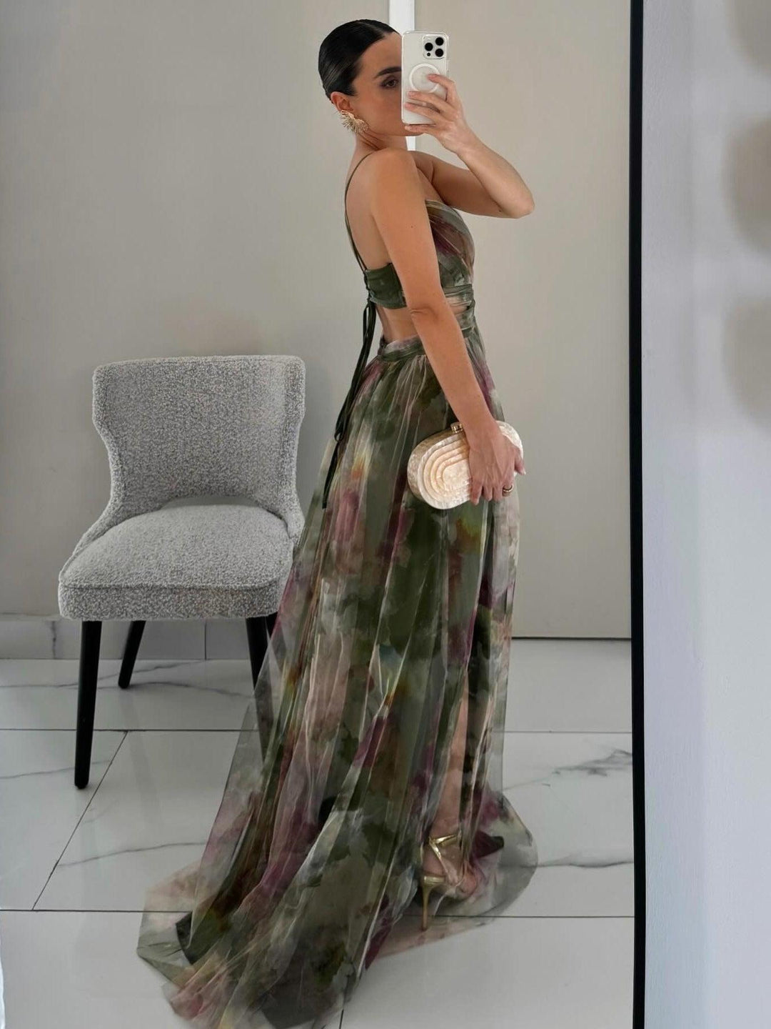 Flowy women's sleeveless floral maxi dress. Comfortable A-line fit with an elegant V-neck and tie-waist.