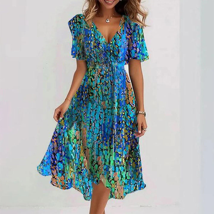 Elegant women's sleeveless midi dress, ideal for summer vacation, beach, or garden party. Flowy & lightweight.