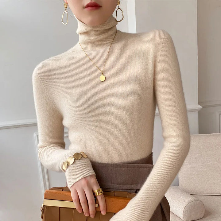 Women's slim fit turtleneck sweater in soft knit, perfect for elegant fall fashion & layering.