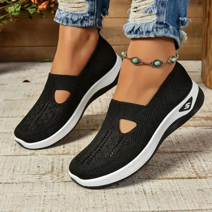 Woman wearing stylish slip-on sneakers, designed for ultimate comfort and everyday versatility.