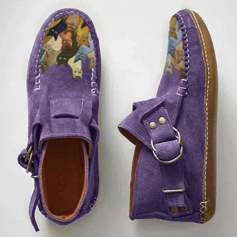 Pair of women's flat slip-on shoes featuring a playful cat print, ideal for comfortable casual footwear.
