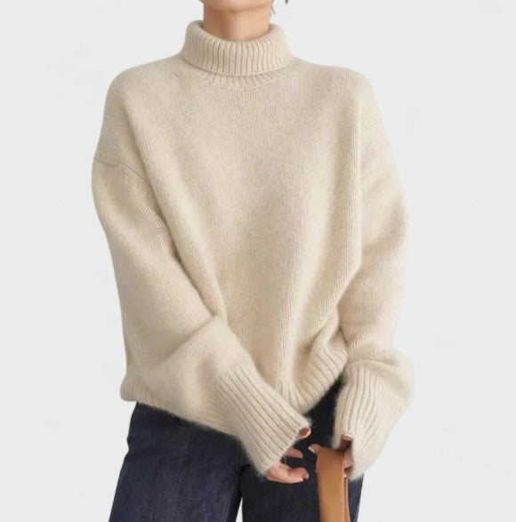 Women's soft cashmere funnel neck sweater in a light color, perfect for elegant winter comfort