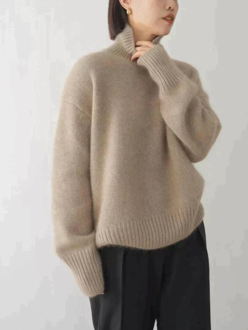 Front view of a minimalist women's cashmere funnel neck sweater, ideal for winter fashion