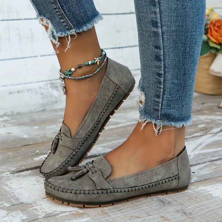 Navy blue women's slip-on loafers, stylish and soft for casual outings.