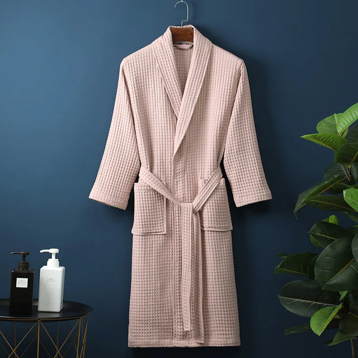 Detail of the tie waist on a women's waffle knit lounge robe, highlighting its adjustable feature.