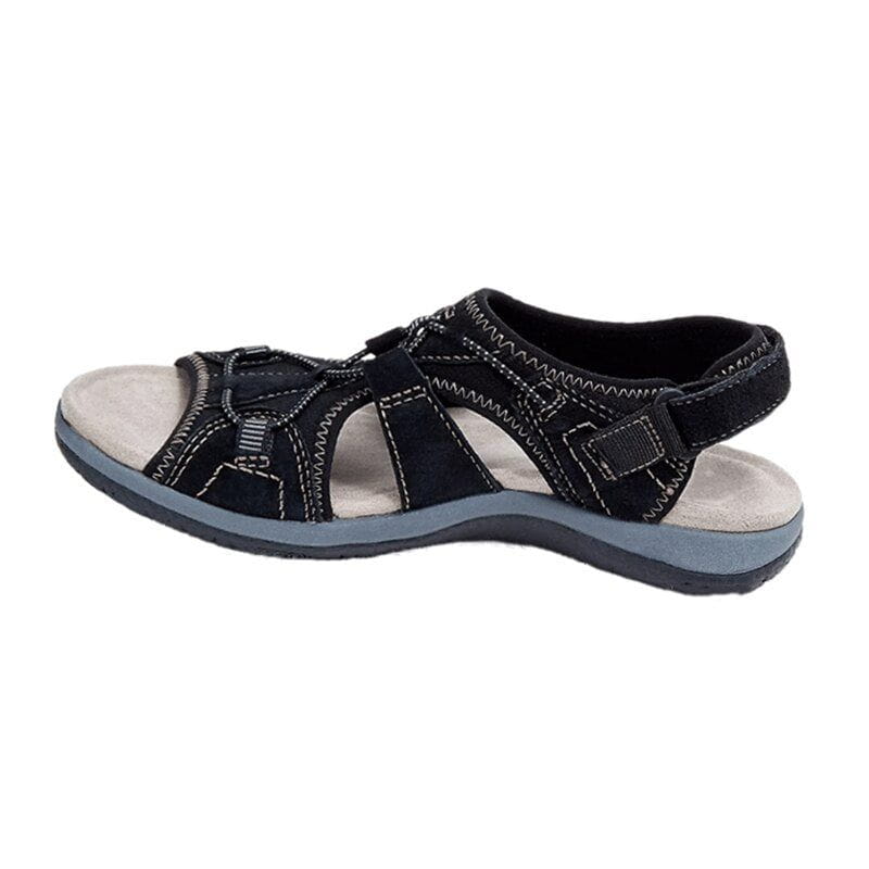 Women's sporty comfort sandals in grey, against a backdrop of spring flowers