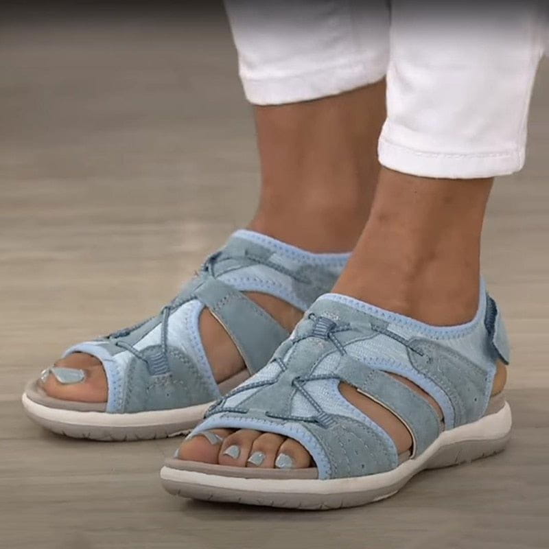 Close-up of women's grey sporty comfort sandals, breathable straps, spring footwear