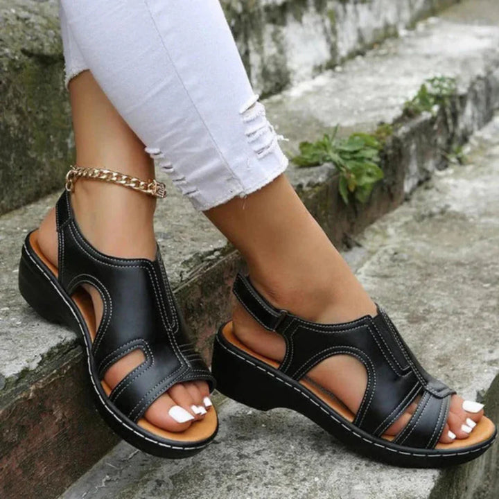 Close-up of cutout detail on women's platform sandal, showcasing intricate spring design
